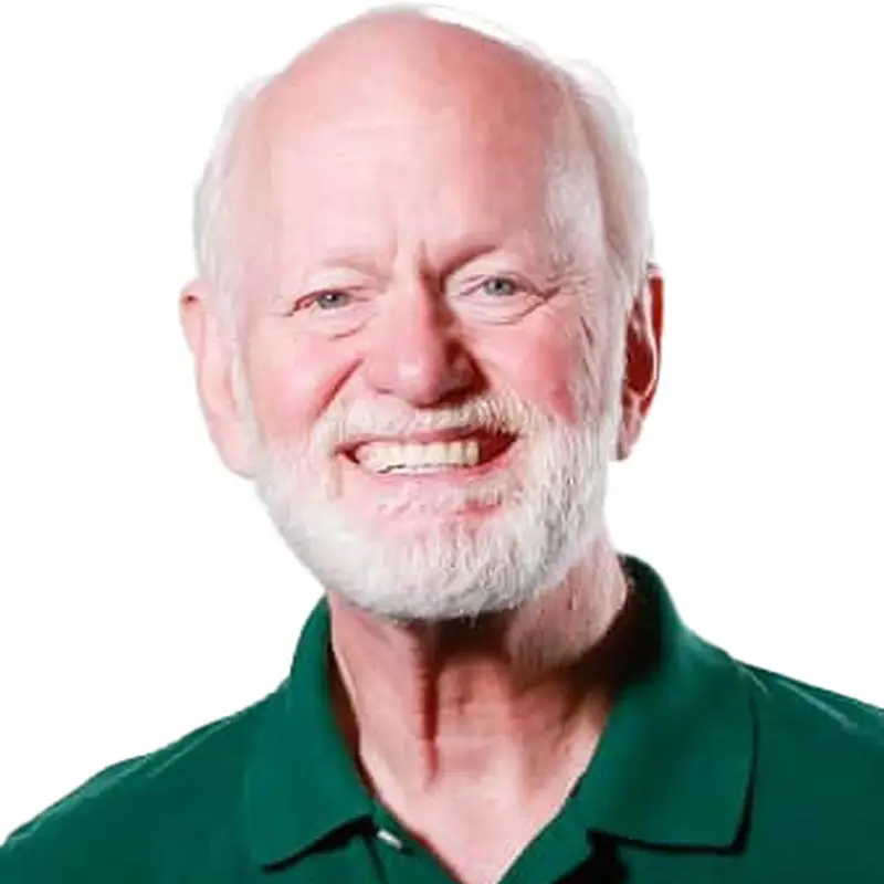 Marshall Goldsmith, Coacharya board member, smiling in a green polo shirt