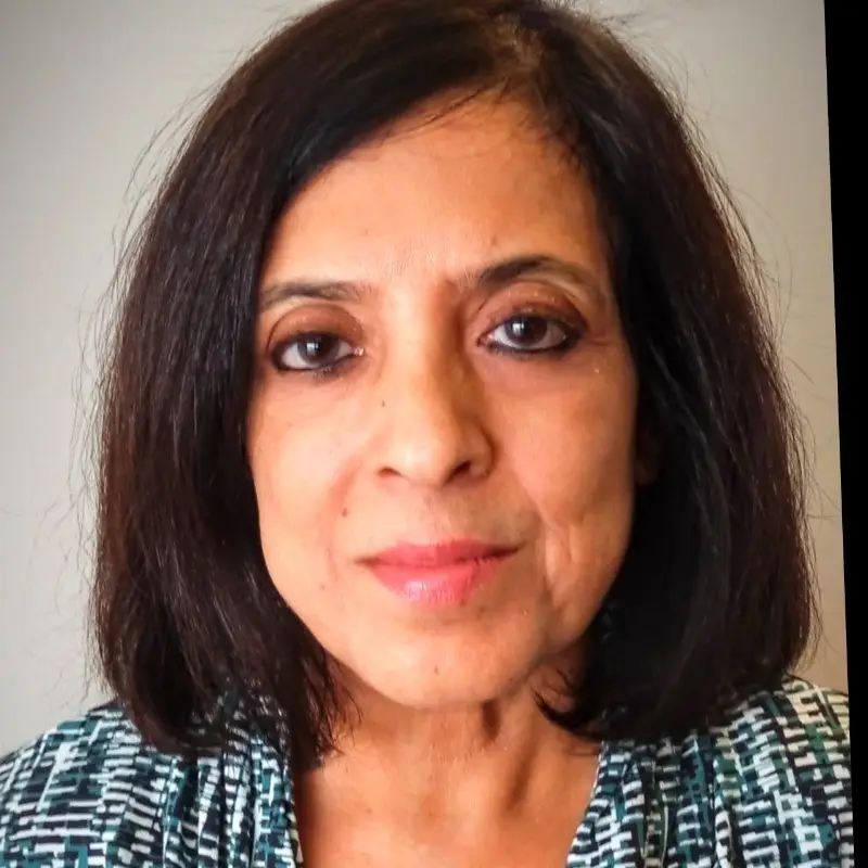 Nitha Shirali, Manager of Programs at Coacharya Foundation, in a blue and white patterned top