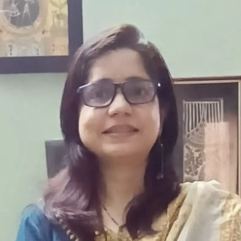 Rupa Origanti, Coacharya team member, in a blue kurta and patterned dupatta